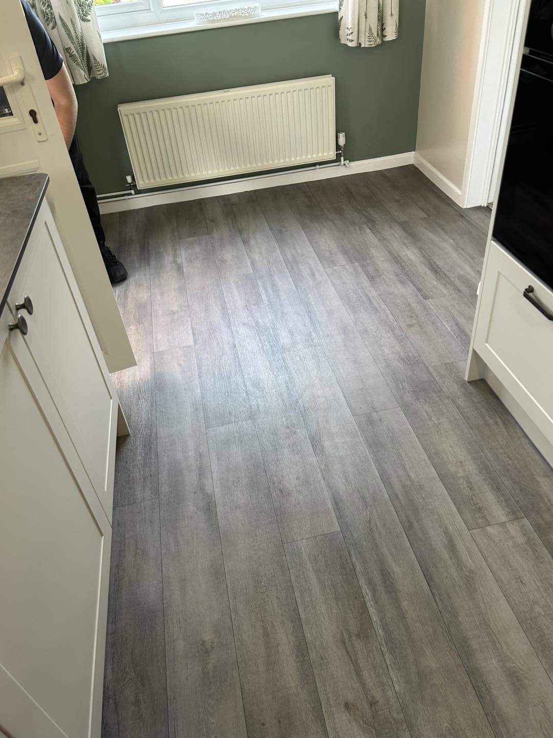 Grey wood-effect vinyl laid in a kitchen