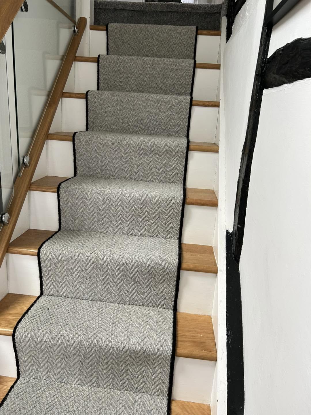 Grey herringbone stair runner with black binding, fitted by Your floor