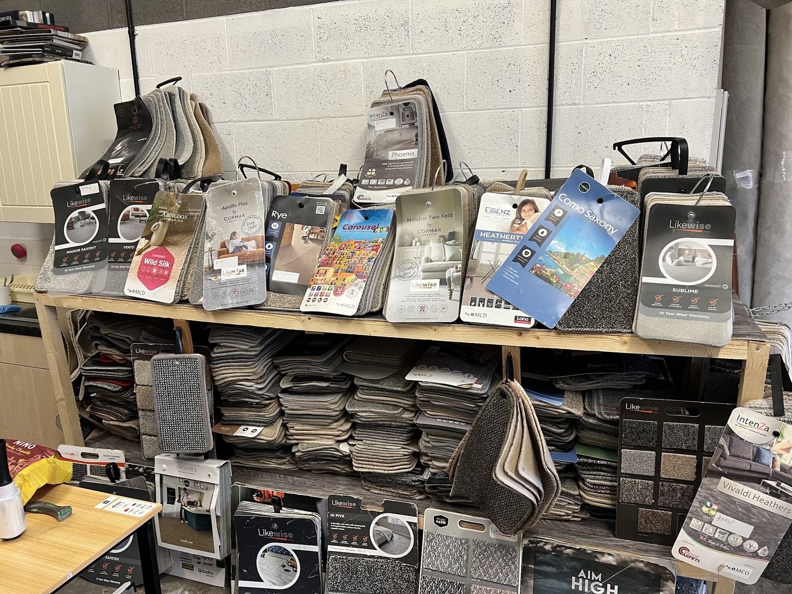 Sample books and carpet samples on the showroom shelves
