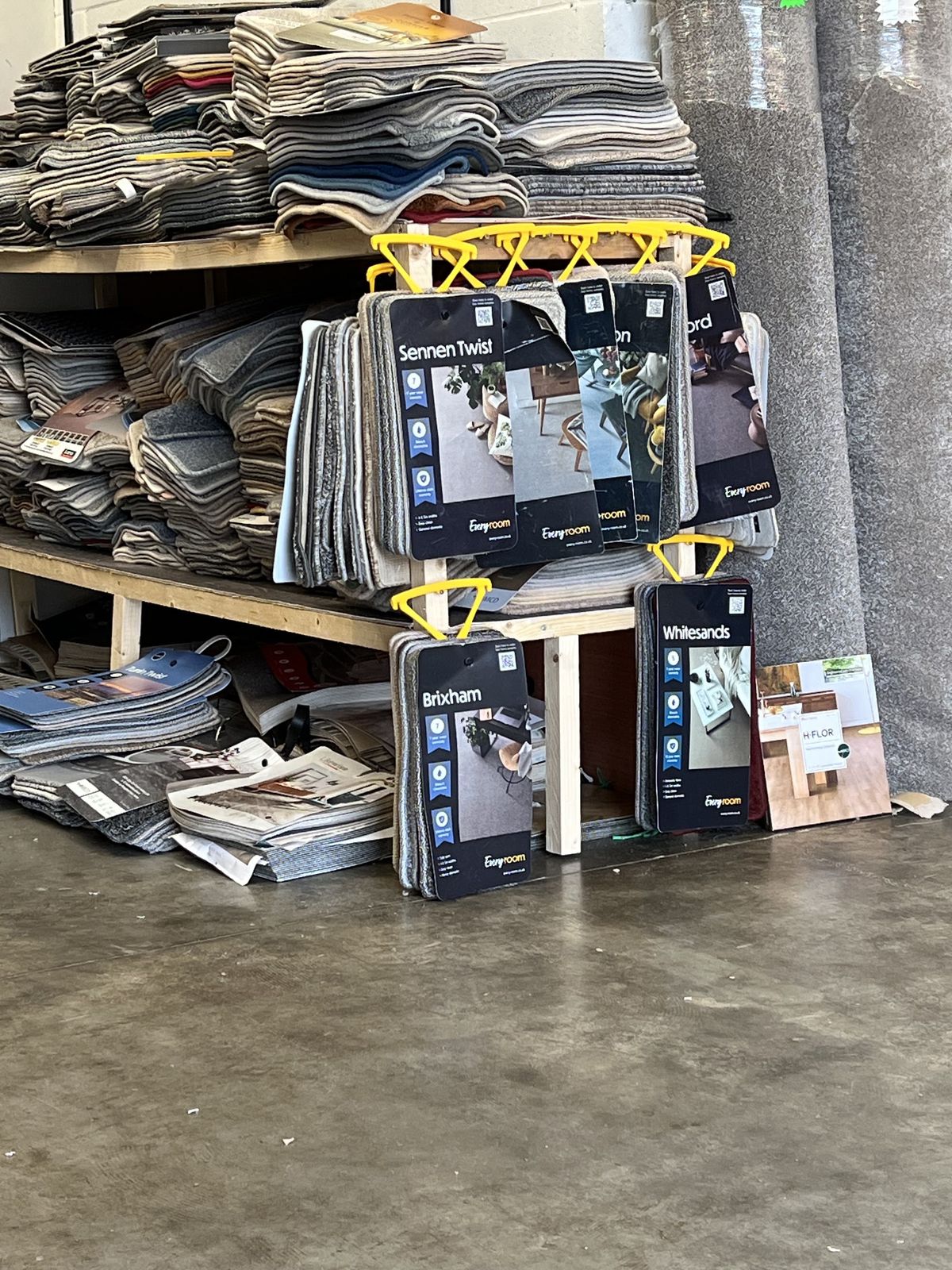 Carpet sample stands and stacks of samples in the showroom