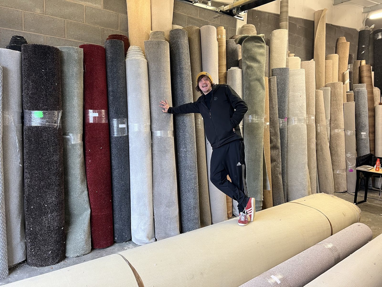 Rolls of carpet stood up in the Your floor warehouse